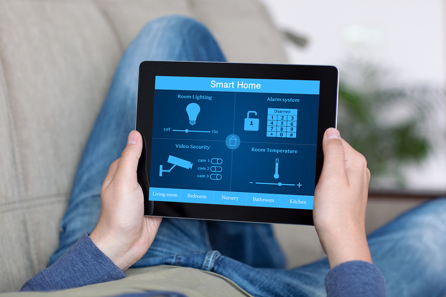 Man Holding Tablet With Program Smart Home On The Screen